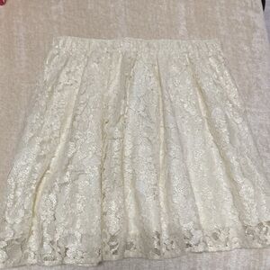 Elegant Cream Lace Skirt with Elastic Waist and Sparkling Lace Flowers.